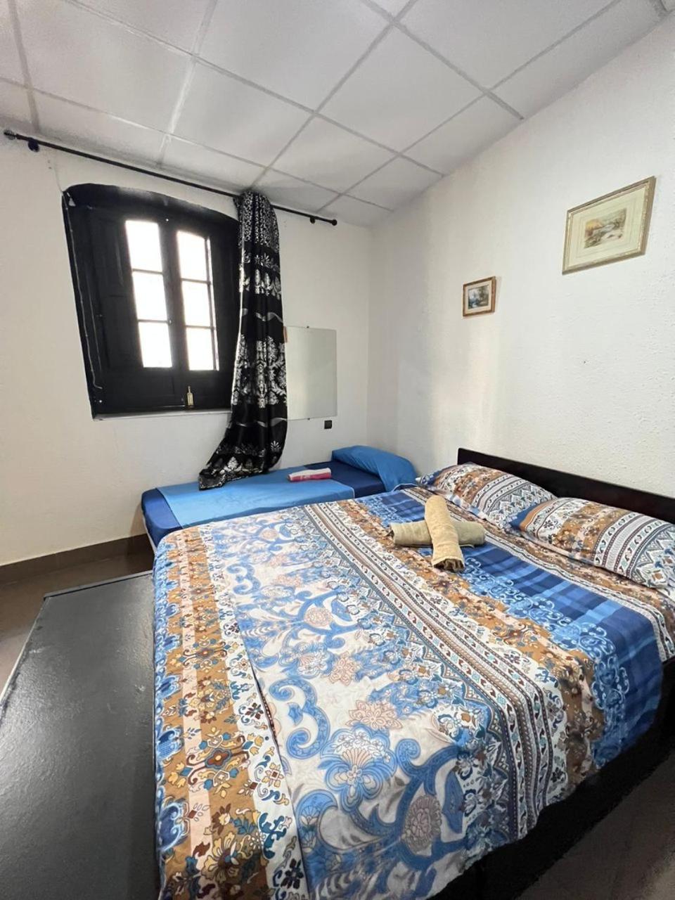 Hostal Milan Alicante Exterior foto A bedroom in a guest house in India